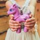 Hands purple child holding